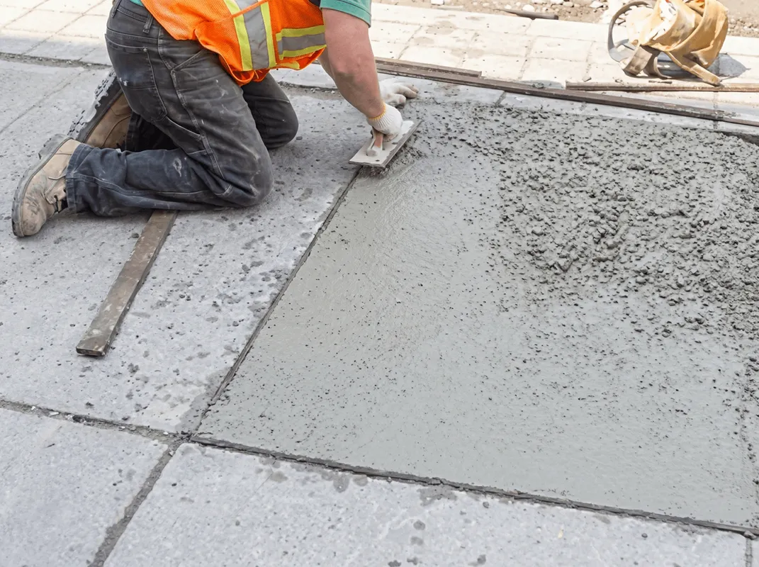 Professional repairing a concrete floor in Syracuse, NY